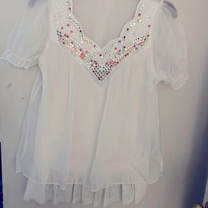 Lightweight sheer top with rhinestone neckline